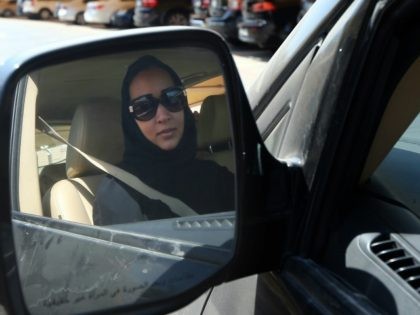 Saudi activist Manal Al Sharif, who now lives in Dubai, drives her car in the Gulf Emirate city on October 22, 2013, as she campagins in solidarity with Saudi women preparing to take to the wheel on October 26, defying the Saudi authorities, to fight for women's right to drive …