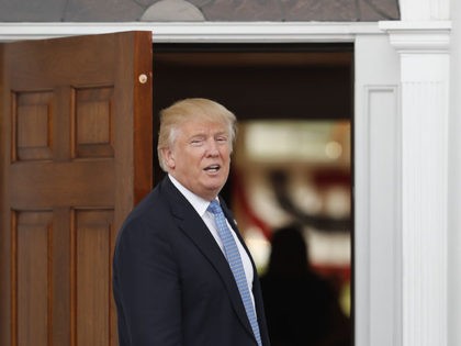 President-elect Donald Trump calls to media from the entryway of Trump National Golf Club Bedminster clubhouse, Sunday, Nov. 20, 2016 in Bedminster, N.J.. (AP Photo/Carolyn Kaster)