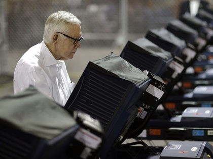 Senate Minority Leader Harry Reid of Nev., votes at an early voting site Wednesday, Oct. 2
