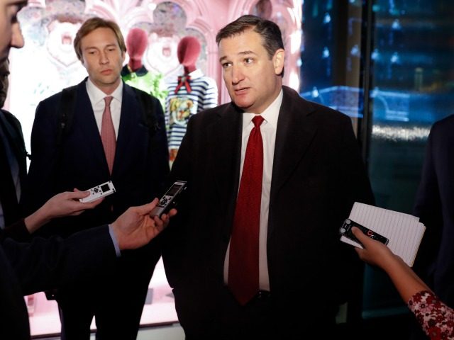 Sen. Ted Cruz, R-Texas, pauses to talk with media as he leaves Trump Tower, Tuesday, Nov.