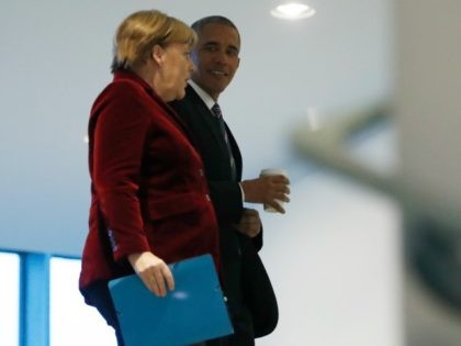 President Barack Obama walks with German Chancellor Angela Merkel at the German Chanceller