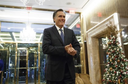 Former Republican presidential nominee Gov. Mitt Romney talks with reporters after eating