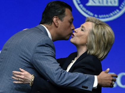 Alex Padilla kisses Hillary Clinton (David Becker / Associated Press)