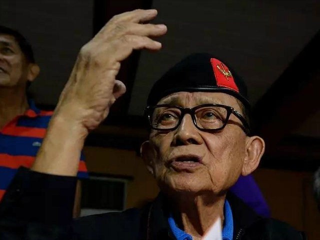 Former Philippine president Fidel Ramos (R) gestures during a press conference at Camp Agu
