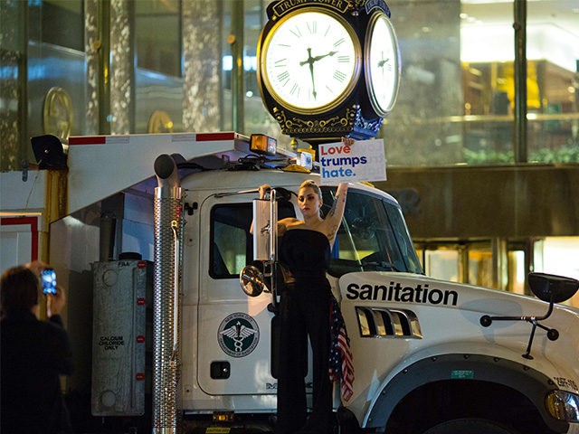 TOPSHOT - Musician Lady Gaga stages a protest against Republican presidential nominee Donald Trump on a sanitation truck outside Trump Tower in New York City after midnight on election day November 9, 2016. Donald Trump stunned America and the world, riding a wave of populist resentment to defeat Hillary Clinton …