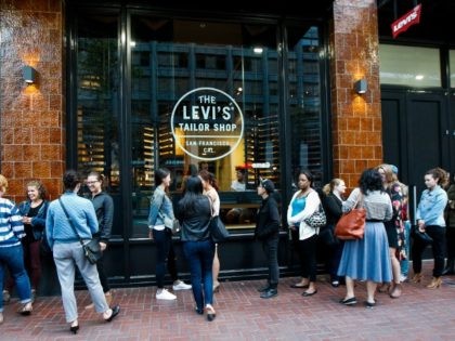 Guests wait to enter an in store private event launching Levi's new Woman's Denim Collection on July 15, 2015 in San Francisco, California. (Photo by )