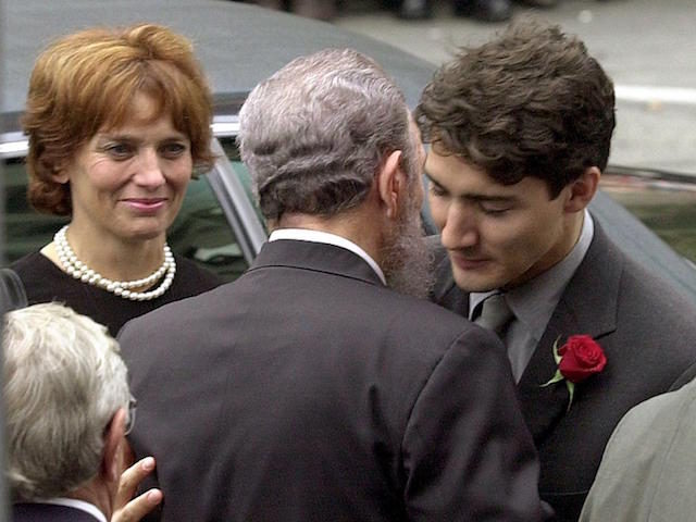 MONTREAL, CANADA: Cuban President Fidel Castro (C) embraces Justin Trudeau (R), the son of former Canadian Prime Minister Pierre Trudeau, after arriving at the Notre Dame Basilica for Trudeau's state funeral 03 October 2000. Trudeau, who was considered to be one of Canada's most charismatic prime ministers, died of prostate …