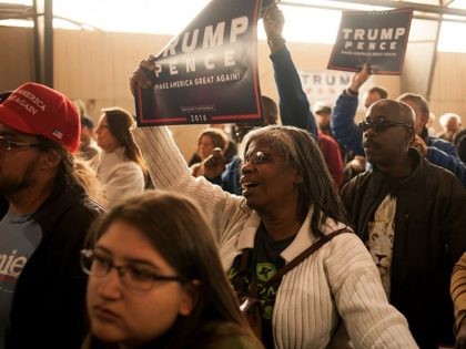 COLORADO SPRINGS, CO - OCTOBER 18: Mary Burney of Colorado Springs cheers during a rally f