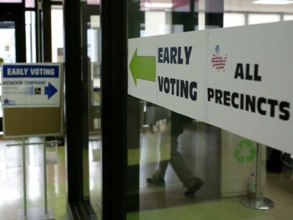 A man walks into a polling station during early voting inside Truman College on October 31