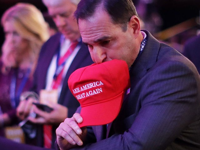 NEW YORK, NY - NOVEMBER 08:  A supporter of Republican presidential nominee Donald Trump watches early results during the election night event at the New York Hilton Midtown on November 8, 2016 in New York City. Americans today will choose between Republican presidential nominee Donald Trump and Democratic presidential nominee Hillary Clinton as they go to the polls to vote for the next president of the United States.  (Photo by Chip Somodevilla/Getty Images)