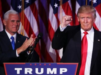 Republican president-elect Donald Trump acknowledges the crowd as Vice president-elect Mike Pence looks on November 9, 2016 in New York City.