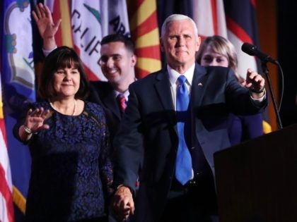 Vice president-elect Mike Pence walks on stage along with members of his family during Republican president-elect Donald Trump's election night event at the New York Hilton Midtown in the early morning hours of November 9, 2016 in New York City.