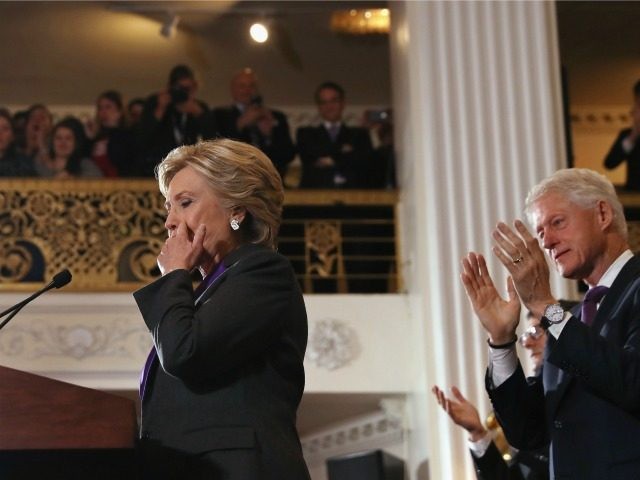Former Secretary of State Hillary Clinton, accompanied by her husband former President Bil