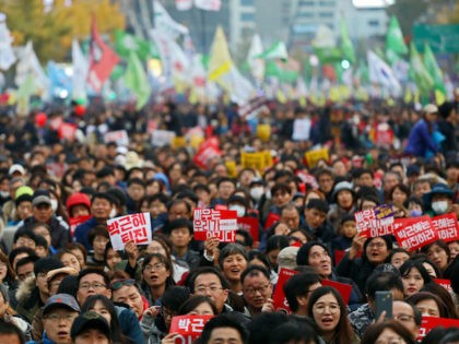 SEOUL, SOUTH KOREA - NOVEMBER 12: Thousands of South Koreans take to the streets in the city center to demand President Park Geun-Hye to step down on November 12, 2016 in Seoul, South Korea. Approximately tens of thousands of people joined the anti-government protest Saturday amid rising public frustration for …