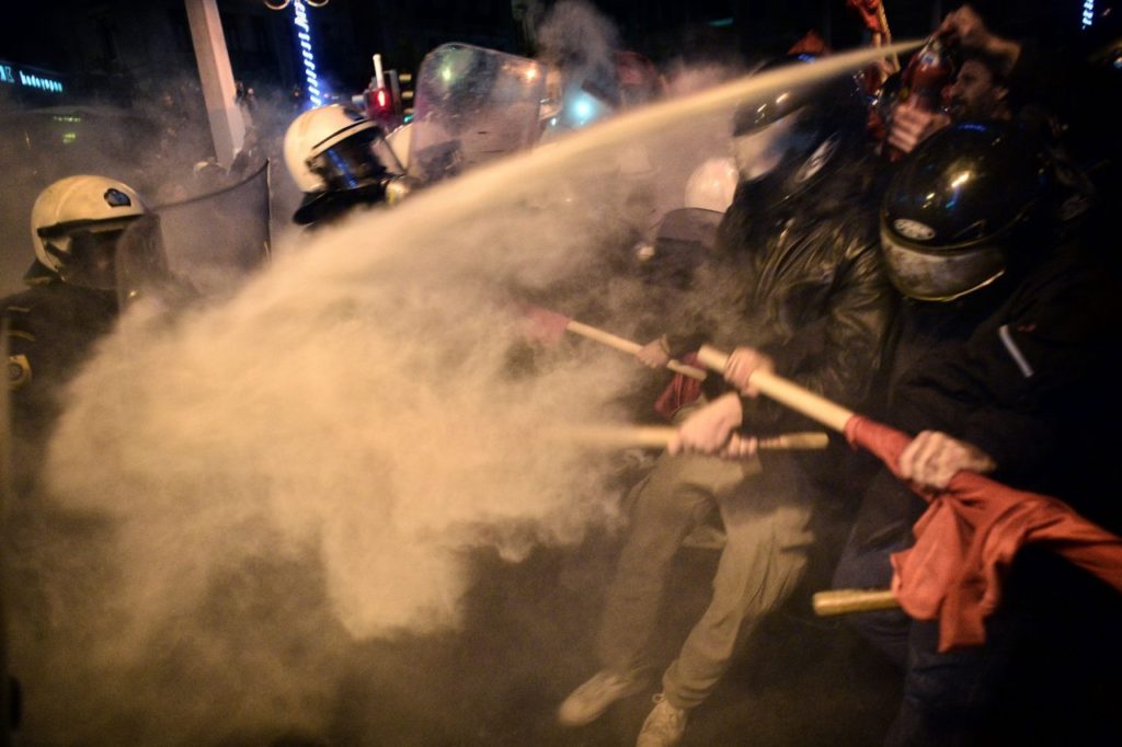 Tear gas is used as demonstrators clash with Greek riot police during a protest against the visit of the US president in Athens on November 15, 2016. US President Barack Obama is in Greece on a two-day official visit. / AFP / LOUISA GOULIAMAKI (Photo credit should read LOUISA GOULIAMAKI/AFP/Getty Images)