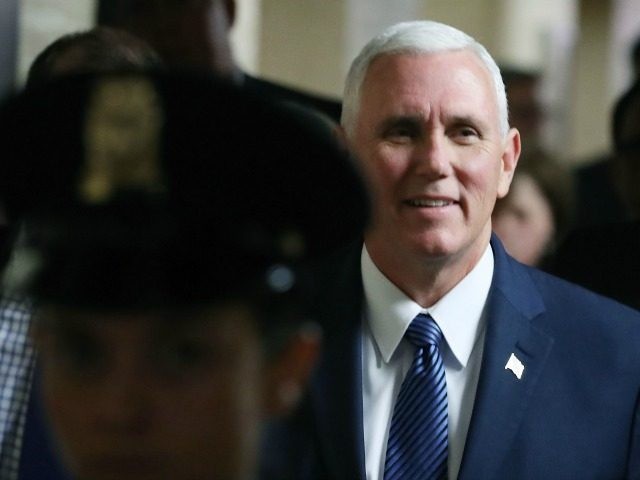 Vice President-elect Gov. Mike Pence (R-IN), is escorted to a closed door House Republican