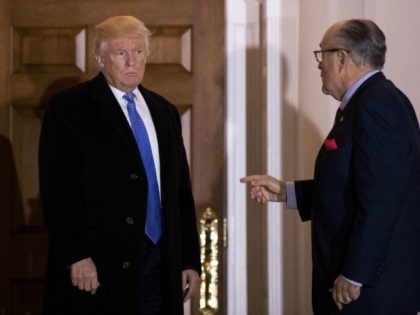 BEDMINSTER TOWNSHIP, NJ - NOVEMBER 20: (L to R) President-elect Donald Trump and former New York City mayor Rudy Giuliani talk to each other as they exit the clubhouse following their meeting at Trump International Golf Club, November 20, 2016 in Bedminster Township, New Jersey. Trump and his transition team …