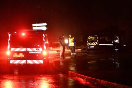 Gendarmes stand guard on a road near a retirement home for monks in Montferrier-sur-Lez, s