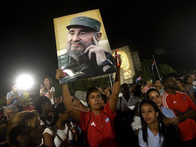 TOPSHOT - People participate in a massive rally at Revolution Square in Havana in honor of late leader Fidel Castro. Castro -- who ruled from 1959 until an illness forced him to hand power to his brother Raul in 2006 -- died Friday at age 90. The cause of death has not been announced. / AFP / RODRIGO ARANGUA (Photo credit should read RODRIGO ARANGUA/AFP/Getty Images)