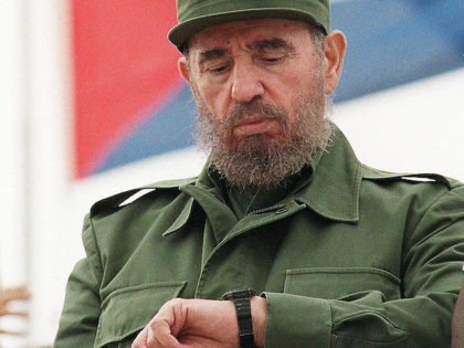 (FILES) Cuban President Fidel Castro checks his watch while watching the traditional Labor Day parade attended by thousands of people in Havana's Plaza of the Revolution, May 1, 1998. Castro resigned on February 19, 2008 as president and commander in chief of Cuba in a message published in the online …