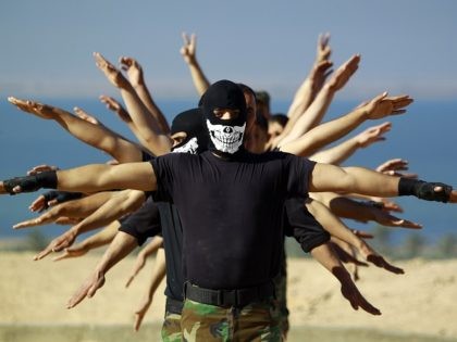 Fighters from the Iraqi Imam Ali Brigade, take part in a training exercise in Iraq's central city of Najaf on March 7, 2015, ahead of joining the military operation in the city of Tikrit. Some 30,000 Iraqi security forces members and allied fighters launched an operation to retake Tikrit at …