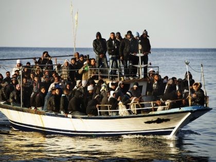 A boat full of would be immigrants is seen near the Italian island of Lampedusa on March 7