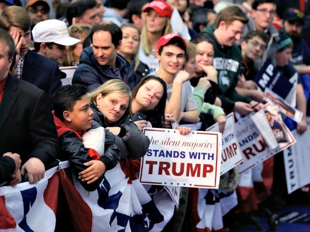 Supporters of Republican presidential candidate, businessman Donald Trump wait for the candidate to walk the line after speaking to a rally at Macomb Community College, Friday, March 4, 2016, in Warren, Mich. (AP Photo/Carlos Osorio)