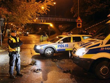 Police secure the area where two immigrant women where shot through an apartment window in Sorbacksgatan in Malmo on October 21, 2010. SCANPIX-SWEDEN/AFP/Getty Images