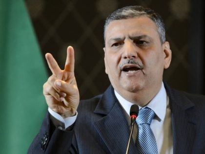 HNC coordinator Riad Hijab shows gestures during a press conference of the HCN in Geneva o