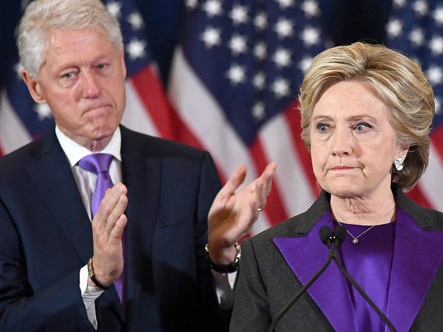 TOPSHOT - US Democratic presidential candidate Hillary Clinton makes a concession speech after being defeated by Republican President-elect Donald Trump, as former President Bill Clinton looks on in New York on November 9, 2016. / AFP / JEWEL SAMAD (Photo credit should read JEWEL SAMAD/AFP/Getty Images)