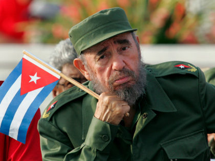 Cuban President Fidel Castro listens to a speaker during the May Day parade in Havana's Re