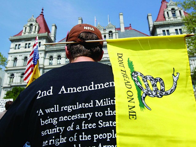 Brandon Oathout of Johnstown, N.Y., attends a Second Amendment rally at the Capitol on Tuesday, May 21, 2013, in Albany, N.Y. A few hundred people gathered for the rally pressing for repeal of the state's new tough laws that were enacted a month after the Newtown, Ct., school massacre. (AP …