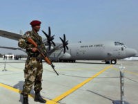 india-military-china-border-2011-ap-file-photo FILE- In this Feb. 5, 2011 file photo, a Special Forces commando stands guard near the C-130J-30 Super Hercules aircraft that it inducted into its transportation fleet, at a ceremony at the Air Force Station at Hindon near New Delhi, India. India is beefing up its defenses with new infantry …