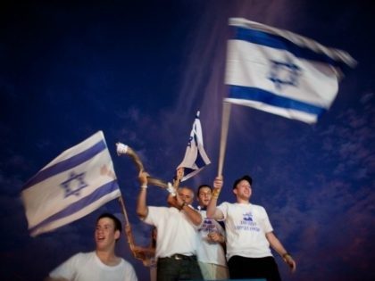 Supporters of freed Israeli soldier Gilad Shalit celebrate on his arrival to his home on October 18, 2011 in Mitzpe Hila, Israel. Shalit was freed after being held captive for five years in Gaza by Hamas militants, in a deal which saw Israel releasing more than 1,000 Palestinian prisoners. (Photo …
