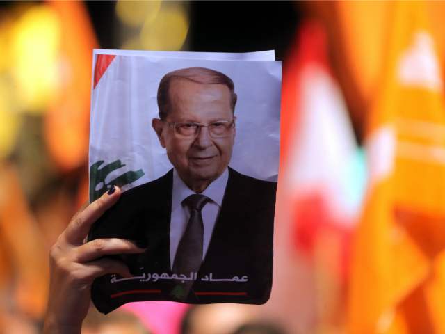 Lebanese celebrate the election for president of Michel Aoun (portrait), a former general