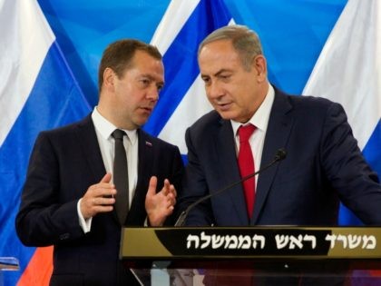Israeli Prime Minister Benjamin Netanyahu (R) listens to his Russian counterpart Dmitry Medvedev as they deliver joint statements following their meeting in Jerusalem, on November 10, 2016. / AFP / POOL / HEIDI LEVINE (Photo credit should read HEIDI LEVINE/AFP/Getty Images)