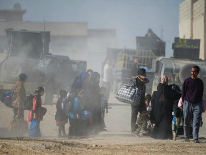 People fleeing the fighting are seen walking to an area held by the Iraqi Special Forces 2