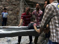 rescuers-boy-airstrike-east-aleppo-syria-ap In this picture taken, Tuesday, Oct. 11, 2016, provided by the Syrian Civil Defense group known as the White Helmets, Syrian Civil Defense workers take out a boy, alive, from the rubble, in rebel-held eastern Aleppo, Syria. Activists and rescue workers say an intensive day of bombing on besieged rebel-held …