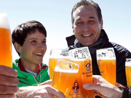 Frauke Petry (L), chairwoman of the anti-immigration party Alternative for Germany (AfD), and head of the Austrian Freedom Party (FPOe) Heinz-Christian Strache toast with beer at Germany's highest mountain, the Zugspitze, in Grainau near Garmisch-Partenkirchen, Germany, June 10, 2016. REUTERS/Michaela Rehle