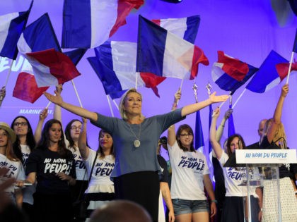 French far-right Front National (FN) party's President, Marine Le Pen, acknowledges the audience on stage during the FN's summer congress in Frejus, southern France, on September 18, 2016. / AFP / Franck PENNANT (Photo credit should read FRANCK PENNANT/AFP/Getty Images)