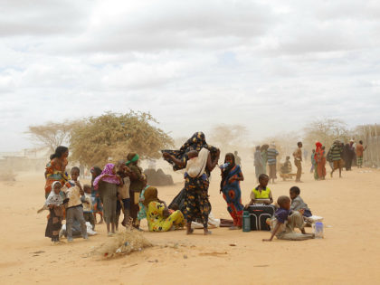 FILE - In this Friday, Aug. 5, 2011 file photo, newly arrived Somali refugees wait outside