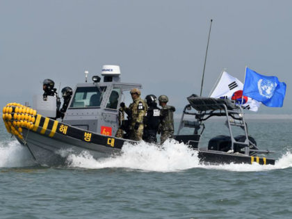 GANGHWA, SOUTH KOREA - JUNE 10: In this handout photo provided by the South Korean Defense Ministry, South Korean marines and navy soldiers on a boat conduct a crackdown against China's illegal fishing in neutral waters on June 10, 2016 in Ganghwa island, South Korea. South Korea sent military vessels …