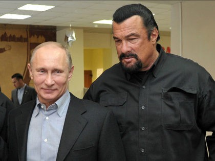 FILE - In this file photo taken on Wednesday, March 13, 2013, Russian President Vladimir Putin, left, and U.S. movie actor Steven Seagal visit a new sports arena in Moscow, Russia. file photo, Russian President Vladimir Putin, right, speaks with U.S. actor Steven Seagal in the Russian Far Eastern port …