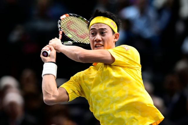 Japan's Kei Nishikori in action against Serbia's Viktor Troicki at the Paris Masters on No