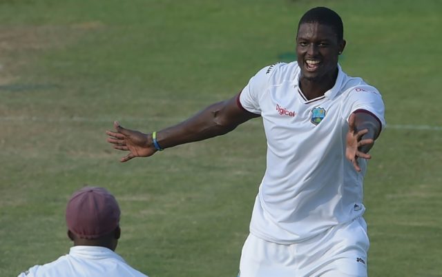 West Indies captain Jason Holder celebrates after taking the wicket of Pakistan's Younis K