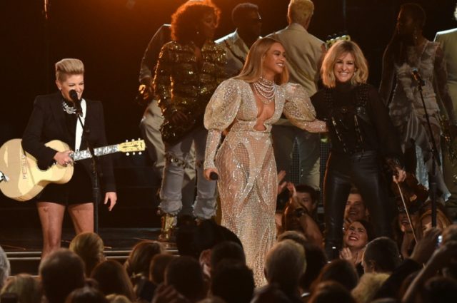 Beyonce performs onstage with Martie Maguire of Dixie Chicks at the 50th annual CMA Awards