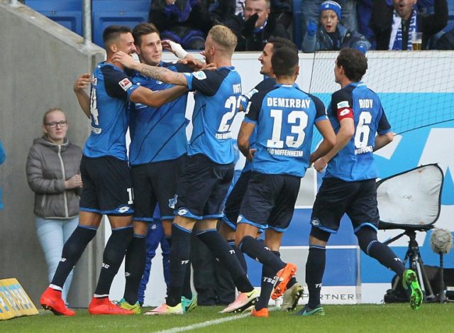 Hoffenheim's Niklas Suele (2nd L) celebrates with teammates after scoring a goal during th