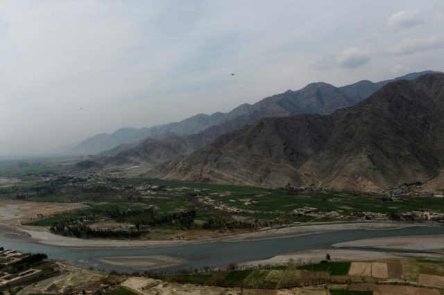 A US helicopter is seen flying over Nari district near an Afghan army outpost in Kunar pro