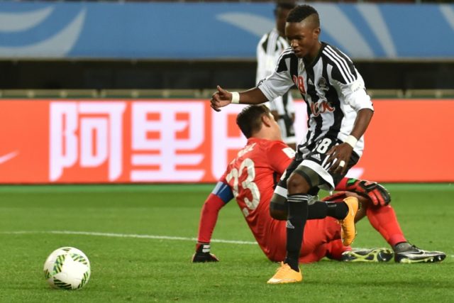 TP Mazembe's Rainford Kalaba (front) tries to pick up the ball following his goal against