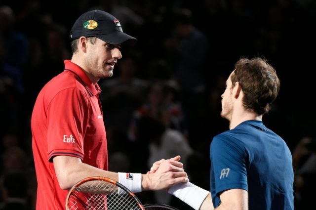 Andy Murray (R) shakes hands with John Isner after winning the Paris Masters on November 6
